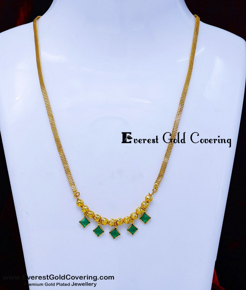 gold chain with green stone